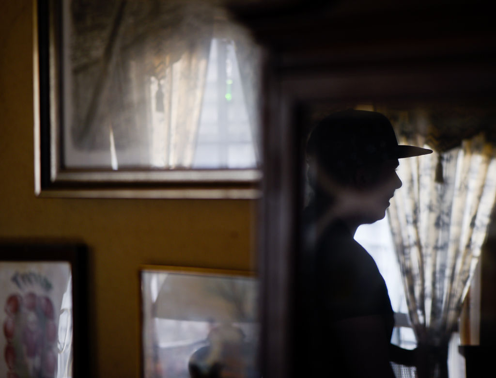 Gary Edge's son reflected in a framed photograph